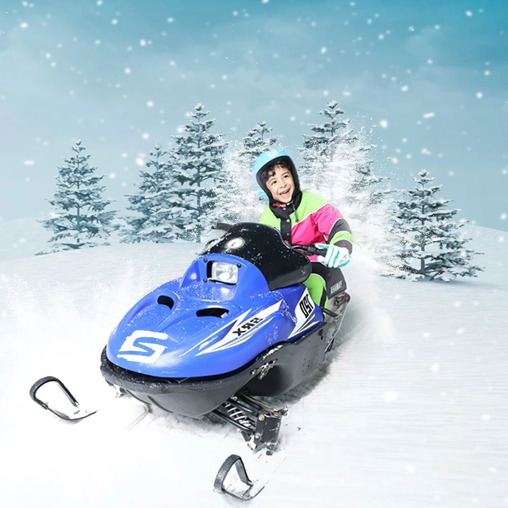 A young boy in a snowmobile at Snow City