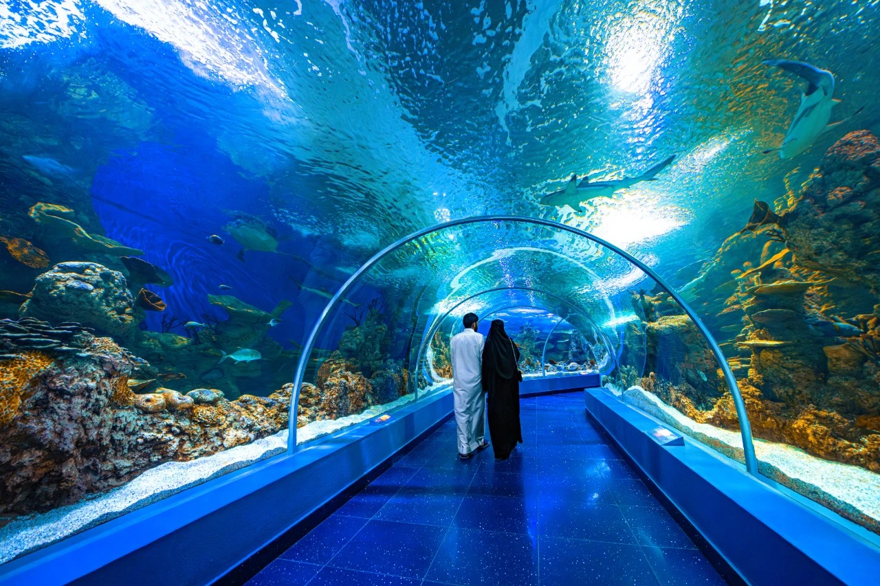 A family walking through the underwater tunnel at Fakieh Aquarium in Jeddah. STA